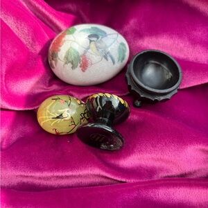 Stone eggs hand painted with display stands.